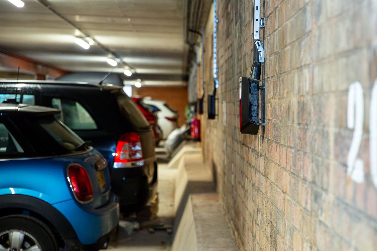 EV chargers fitted beside parked cars